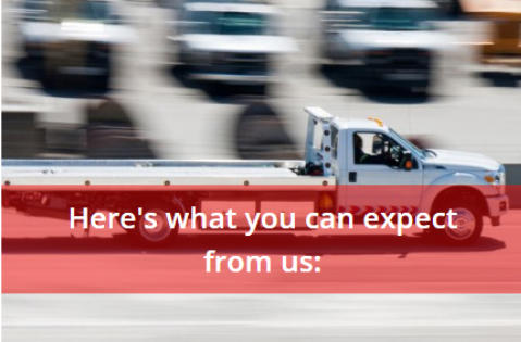 Recovery Truck Traveling on Road